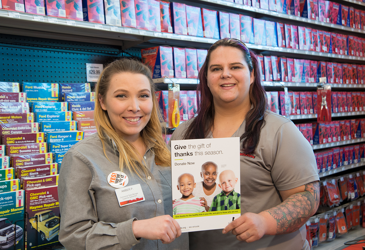 Image of 2 women holding a book